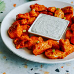 baked buffalo chicken bites on a plate