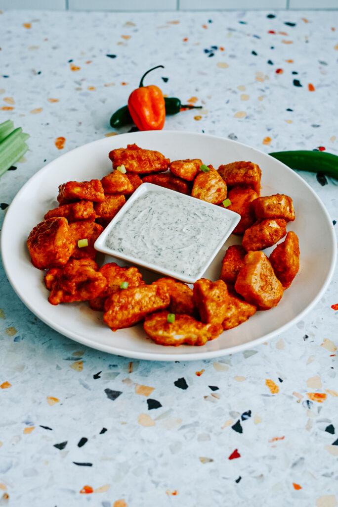 baked buffalo chicken bites on a plate